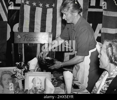 Before every banquet starts, the food is first offered to two chairs in which (in spirit) sit Father Divine and his spotless virgin bride, a white girl, Edna Ritchings, he married in 1946. August 02, 1950. Stock Photo