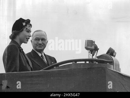 Princess Elizabeth Meets The President -- Princess Elizabeth with the President facing a Barrarge of Microphones after her arrival at Washington Airport. Princess Elizabeth and the Duke of Edinburgh have broken their Canadian tour to spend a few days in the United States at the Invitation of President Truman. November 02, 1951. (Photo by Paul Popper Ltd.). Stock Photo