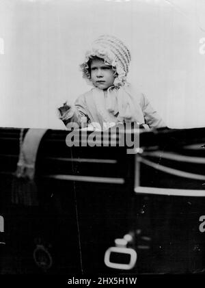 The New Queen As A Baby -- Britain's new Queen, then the baby Princess Elizabeth daughter of the Duke and Duchess of York (later King and Queen of England) - waves from the carriage as she drives in London in 1928. Princess Elizabeth, born in 1926, succeeds to the throne on the death of her father, King George VI, who died in his sleep at Sandringham early to-day. February 16, 1952. (Photo by Reuterphoto). Stock Photo