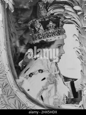 Our Smiling Queen Drives in Procession Through The Streets of London. A close-up of the newly-crowned Queen, wearing the Imperial State Crown, her sunny smile defying the grey weather, during her processional drive after her Coronation this afternoon. June 02, 1953. (Photo by Fox Photos). Stock Photo