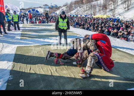 Traditional Nenet wrestling competition at Reindeer Herders Festival in Salekhard, Yamalo-Nenets Autonomous Okrug, Russia Stock Photo