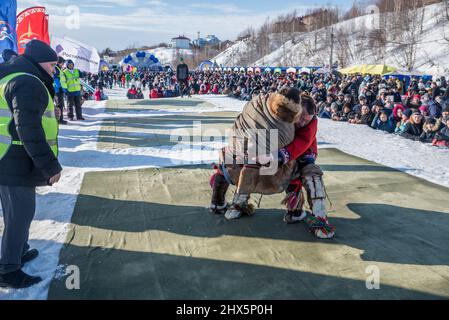 Traditional Nenet wrestling competition at Reindeer Herders Festival in Salekhard, Yamalo-Nenets Autonomous Okrug, Russia Stock Photo