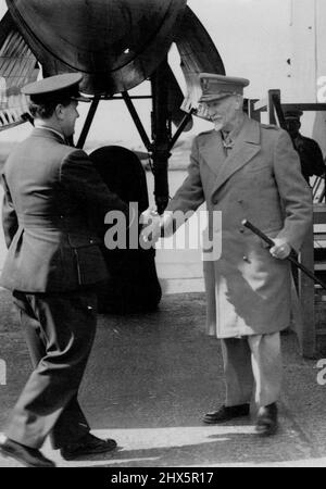 Field Marshal Smuts Arrives In Great Britain -- Field Marshal Smuts being greeted at the airfield, where he arrived, by Air Commodore Brackley. Field Marshal Smuts, Prime Minister of South Africa, arrived in Gt. Britain to-day to attend the London Conference of Empire and Commonwealth delegates to San Francisco, World Peace Conference. April 3, 1945. Stock Photo