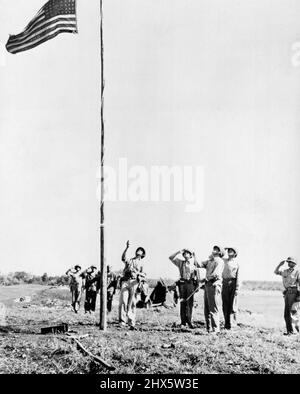 Troops Raise U.S. Flag on Guadalcanal Island. - One of the first acts of the U.S. Marines after landing on Guadalcanal was to raise the American flag. November 10, 1949. Stock Photo