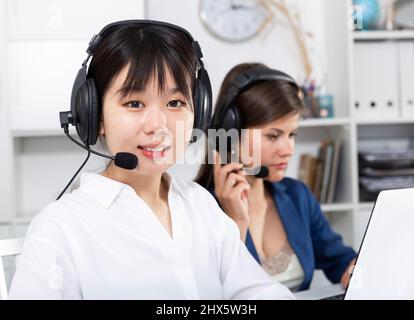 Operators working with computers in an office Stock Photo