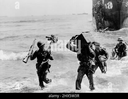 L.G.I. landing craft following amphibious craft in the Allied landing on Mortal Island in the Moluccas being unable to get close into shore the troops had to land in comparatively deep water. September 19, 1944. Stock Photo