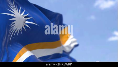 Detail of the national flag of Marshall Islands waving in the wind on a clear day. Marshall Islands is an independent island country near the Equator Stock Photo