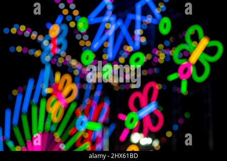Blured Multi-colored neon lights at night. Stock Photo
