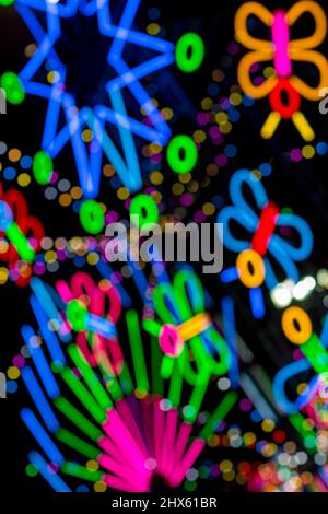 Blured Multi-colored neon lights at night. Stock Photo