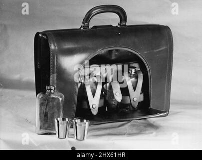 Innocent-Looking briefcase carries papers, but contains two flasks for whisky and ice-water and six silver goblets. December 10, 1953.;Innocent-Looking briefcase carries papers, but contains two flasks for whisky and ice-water and six silver goblets. Stock Photo