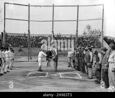 Baseball in Korea: At Souel, Korea, the old American game of baseball, banned by the Japanese for 6 years, was revived when a team of American occupation signalmen met a team from the Korean Amateur Association. The Koreans won, 4-3, before a crowd of ten thousand soldiers and civilians. October 25, 1945. (Photo by Davis, US Army Signal Corps Photo). Stock Photo