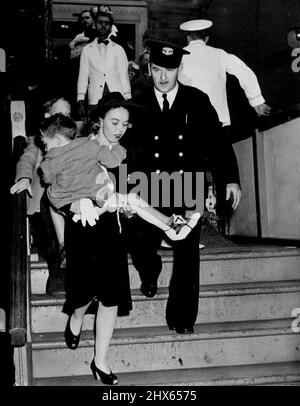 Children, Too, Suffer Wounds In Jap Attack -- A child, bearing the scars of war from then Japanese attack on Pearl Harbor is brought ashore at San Francsico at Honolulu evacuees landed here. December 31, 1941. (Photo by ACME). Stock Photo