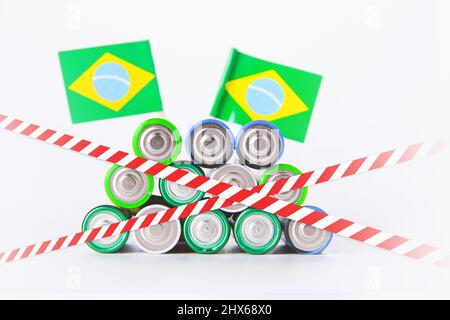 Battery. A lot of batteries on the background of the flag of the country. Stock Photo