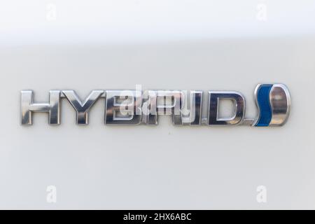 Swat, Pakistan, February 21,2022: Closeup of a Toyota hybrid car logo emblem Stock Photo