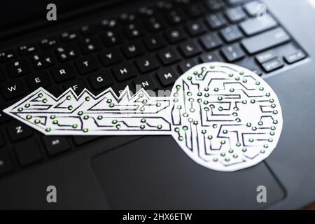 encryption key icon made of circuits and LED lights on top of laptop keyboard, concept of digital security or data encryption Stock Photo
