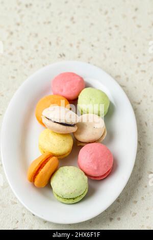 Colorful Assorted Mini macaroon on White Plate Stock Photo