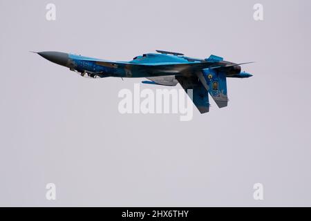 Ukrainian Air force Sukhoi SU-27 Flanker digital blue fighter jet plane flying at speed and displaying combat manoeuvres at the RIAT Airshow in 2017. Stock Photo