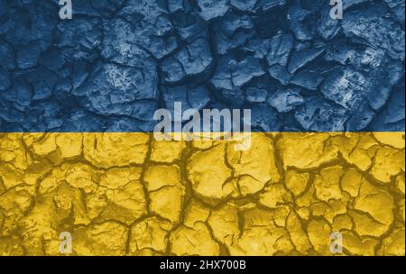 Ukrainian national flag pattern cracked earth, war concept Stock Photo