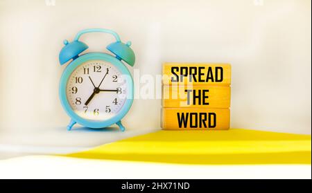 Spread the word word written on wood block. Spread the word text on table, concept. Stock Photo