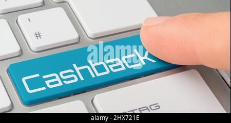 A keyboard with a blue labeled button - Cashback Stock Photo