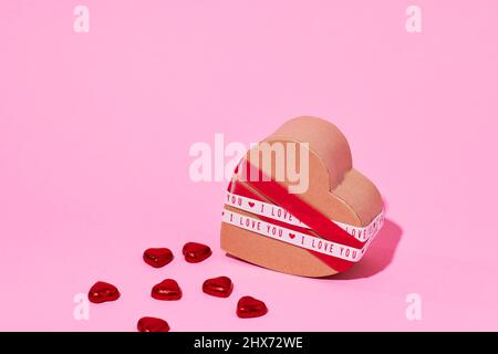 Candies and heart-shaped box Stock Photo