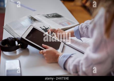 Female student using digital tablet Stock Photo