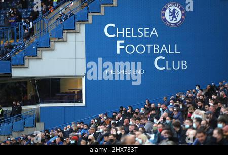 File photo dated 18-05-2021 of Chelsea fans in the stands stands during the Premier League match at Stamford Bridge, London. Roman Abramovich has been sanctioned by the UK Government, freezing the Russian-Israeli billionaire’s planned sale of Chelsea.Chelsea will be given a special licence to continue operation, but the sale of the Stamford Bridge club is now on hold. Issue date: Thursday March 10, 2022. Stock Photo