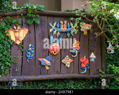 Sculptures made by a local pottery The Paloc village Hollokoe in Hungary, listed as UNESCO world heritage. The traditional farm houses form a complete Stock Photo