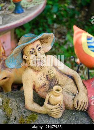 Sculptures made by a local pottery The Paloc village Hollokoe in Hungary, listed as UNESCO world heritage. The traditional farm houses form a complete Stock Photo