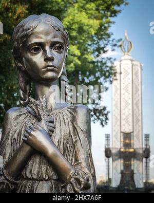 Metal statue of a girls form Holodomor monument memorial in Kiev, Ukraine Stock Photo