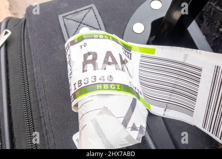 A suitcase with an airline baggage tag shows the three letter airport code for Marrakech, Morocco, RAK Stock Photo