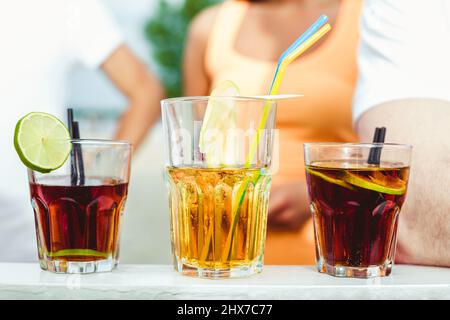 Closeup of three creative sweet alcoholic party cocktails in summer bar. Stock Photo
