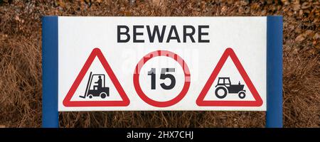 BEWARE sign - warning of forklift trucks and tractors, United Kingdom Stock Photo