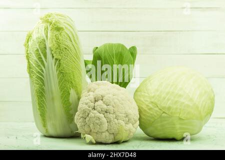 Assortment of different varieties of cabbage cabbage. Background with space for text. Cabbage is different. Various types of green vegetables. white c Stock Photo