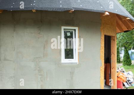 White metal-plastic window in a new building. Window installation process. Background with copy space Stock Photo