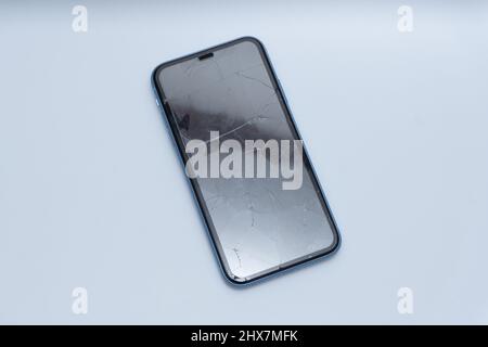 Smartphone with severely damaged screen Stock Photo