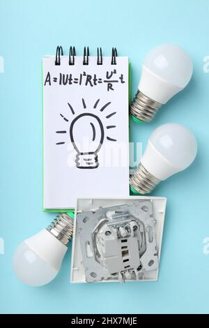 Concept of electrician or electrical tools on blue background Stock Photo