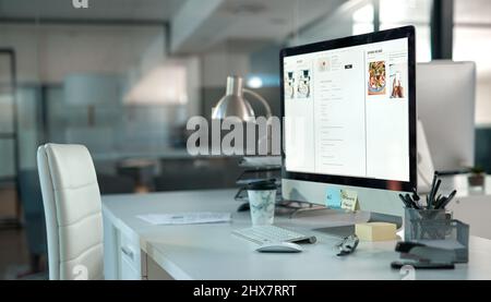 Bring on Monday. Shot of a dek in a modern office setup with a chair and desktop computer. Stock Photo