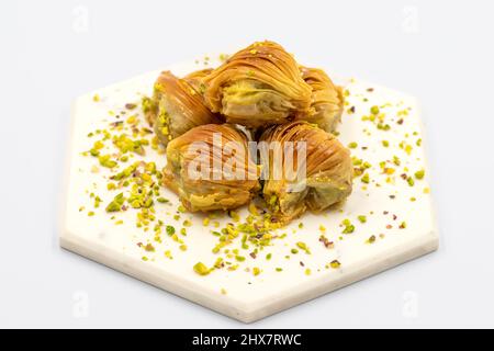 Mussel Baklava with Pistachio. Close-up. Traditional Middle Eastern Flavors. Traditional Turkish baklava. local name midye baklava Stock Photo