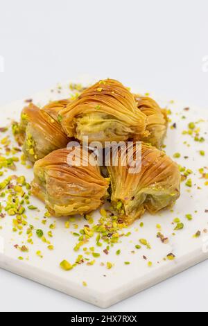 Mussel Baklava with Pistachio. Close-up. Traditional Middle Eastern Flavors. Traditional Turkish baklava. local name midye baklava Stock Photo