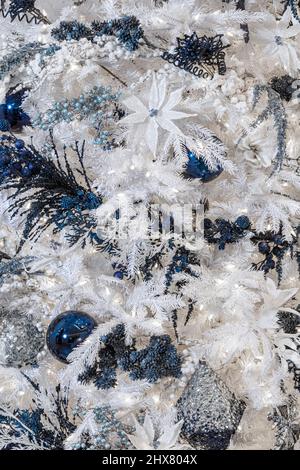 White Christmas tree with blue ornaments, USA Stock Photo