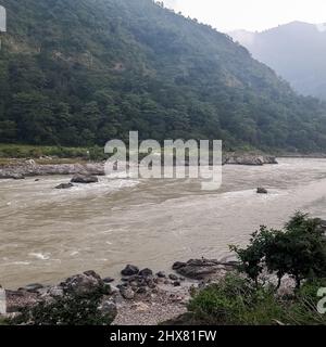 Morning view at GOA beach located in Rishikesh Uttarakhand near Laxman Jhula, Clean view of Ganga river at Rishikesh during early morning time, World Stock Photo