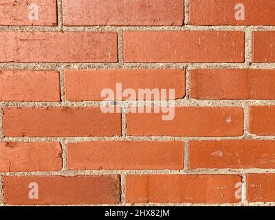 a reddish brown brick wall as background Stock Photo