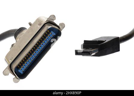Close up of obsolete computer serial connector next to current hdmi cable on white background as concept for obsolete next modern technology and slow Stock Photo