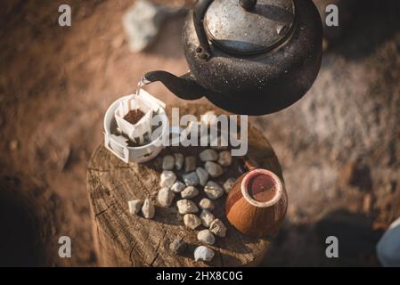 Process of making camping coffee outdoor with metal geyser Stock Photo by  bondarillia