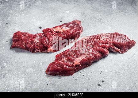 Machete steak raw cut or hanging tender cut. Gray background. Top view Stock Photo