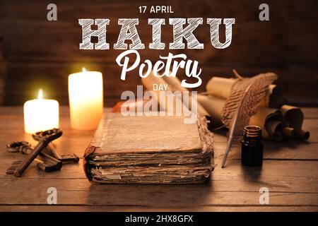 Old book with feather pen and ink on wooden background. Haiku Poetry Day Stock Photo