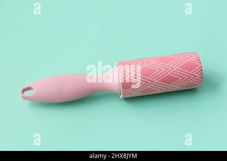 New lint roller on color background Stock Photo