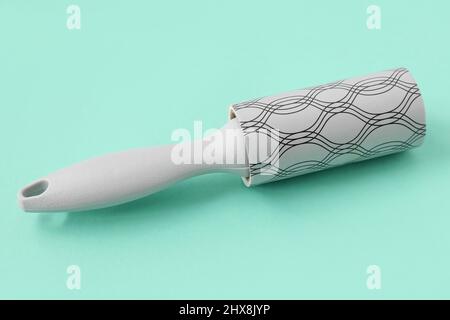 New lint roller on color background Stock Photo