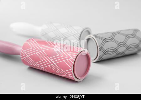 New lint rollers on light background, closeup Stock Photo